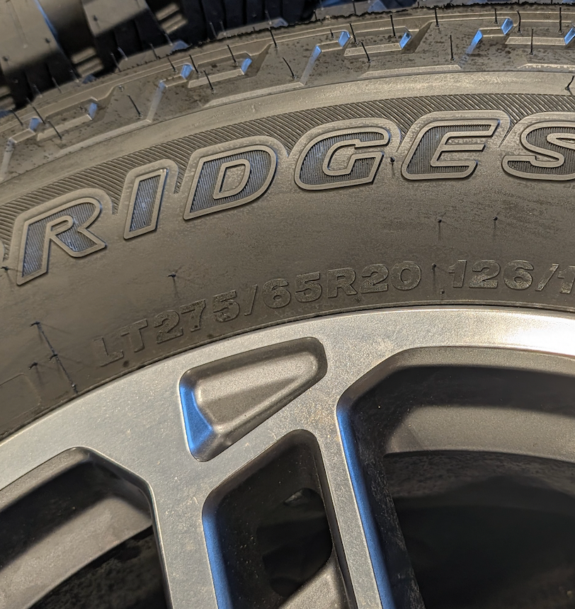 OEM 20” Ford Limited / Platinum Wheels wrapped in Bridgestone Dueler tires.