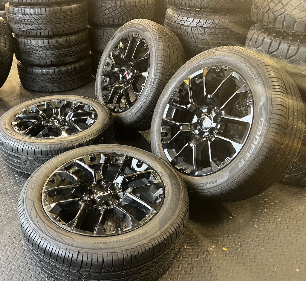 OEM 22” Gloss Black Chevrolet Wheels wrapped in Cooper ProControl tires.