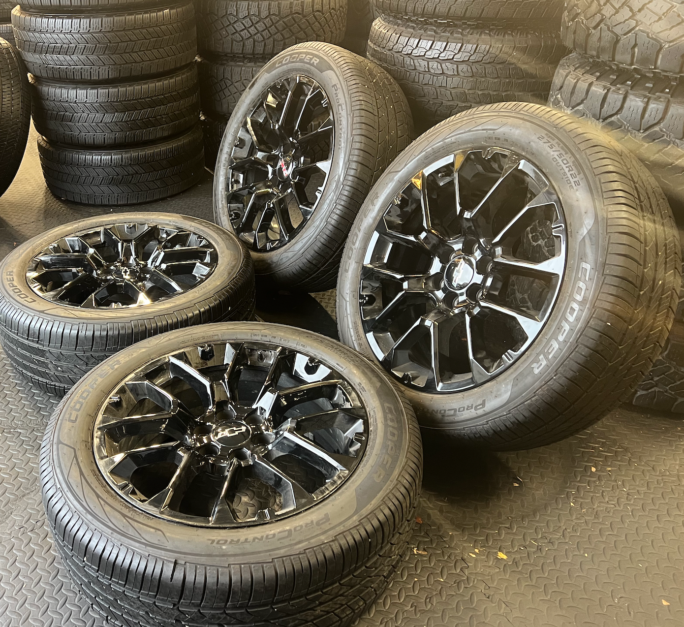 OEM 22” Gloss Black Chevrolet Wheels wrapped in Cooper ProControl tires.