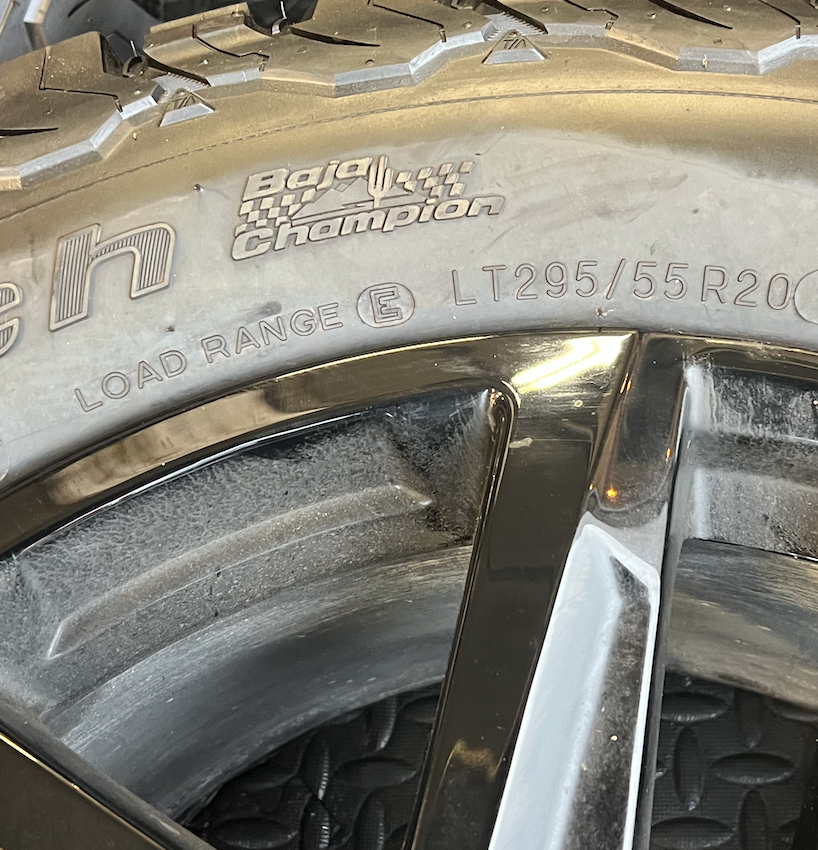 OEM 20” Gloss Black Trail Boss Wheels wrapped in BFGoodrich All-Terrain T/A tires.