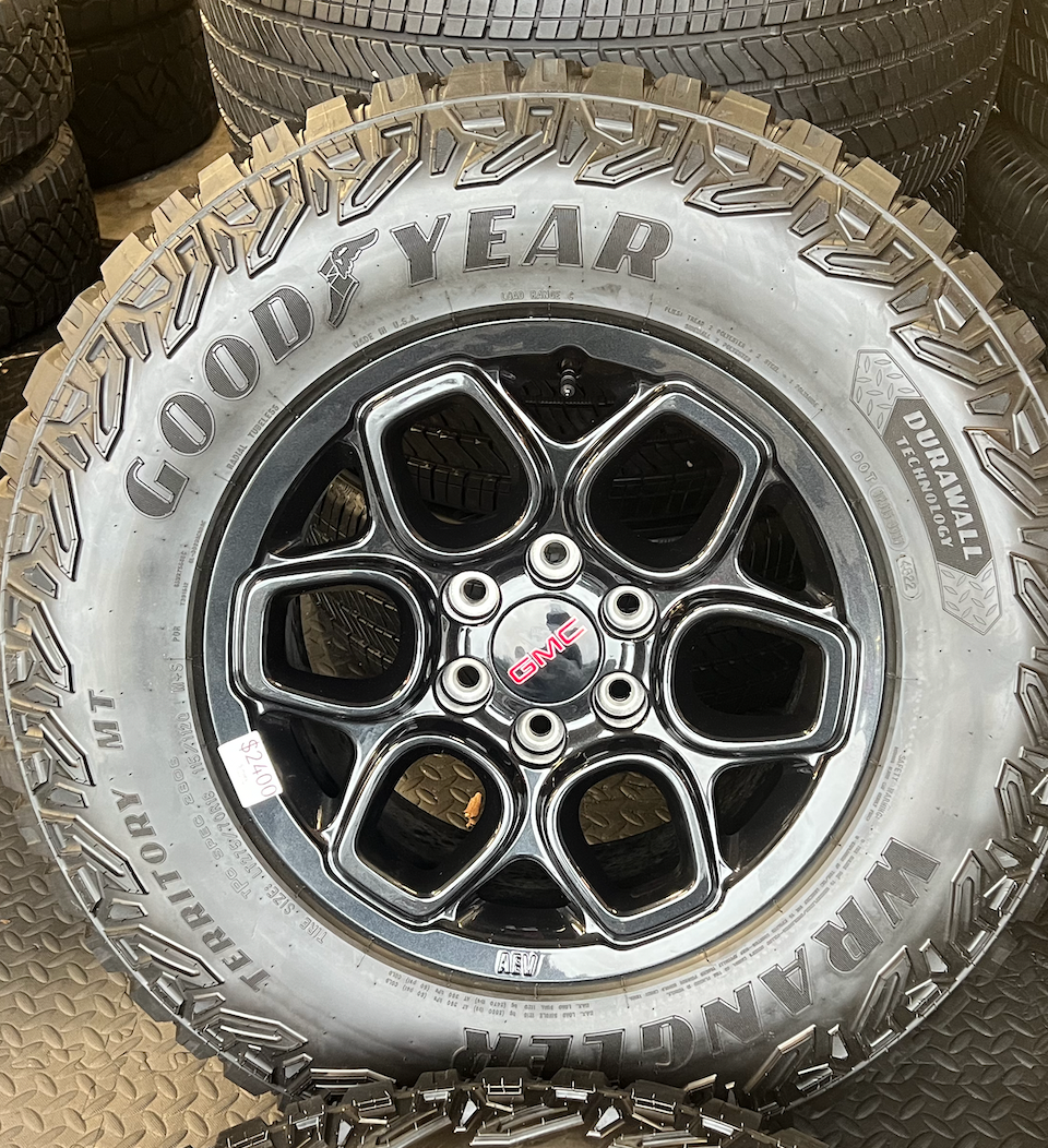 OEM 18”  Wheels wrapped in Goodyear Wrangler Territory M/T tires.