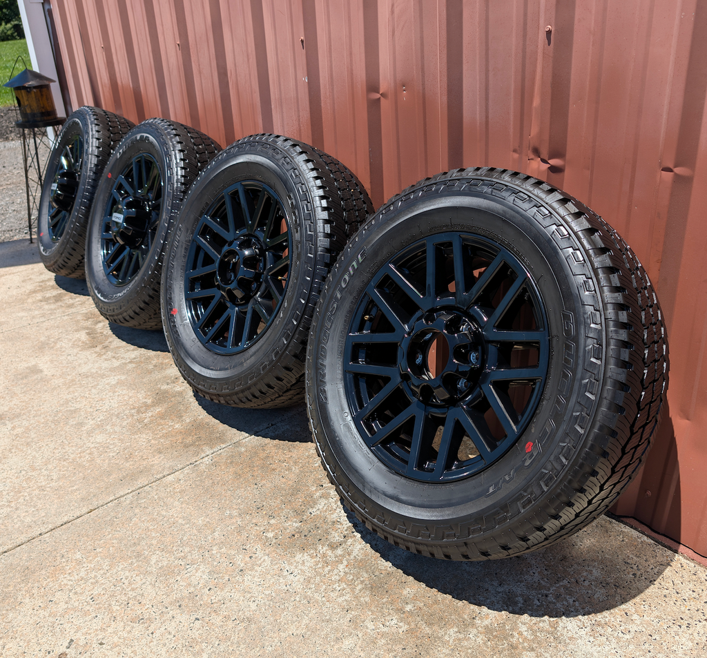 OEM 20” Chevrolet Silverado RST Gunmetal & Machined Wheels wrapped in Goodyear Wrangler TrailRunner A/T tires.