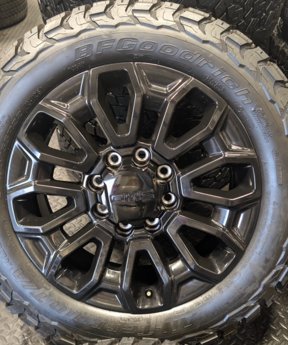 OEM 22” Gloss Black GMC Sierra 2500HD / 3500HD Wheels wrapped in BFGoodrich All-Terrain T/A KO2/KO3 tires.