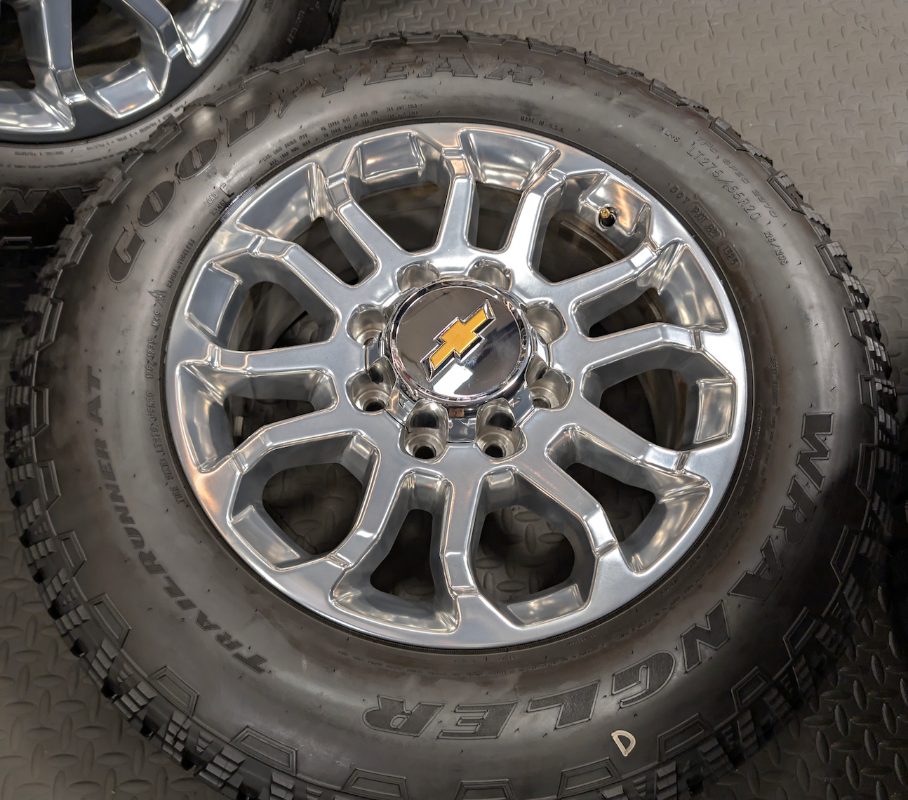 Polished Chevrolet Silverado 2500HD / 3500HD LTZ OEM 20” Wrapped in Goodyear Wrangler TrailRunner A/T LT275/65R20