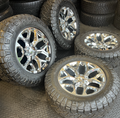 OEM 20” Chrome Truck Wheels wrapped in Nitto Ridge Grappler tires.