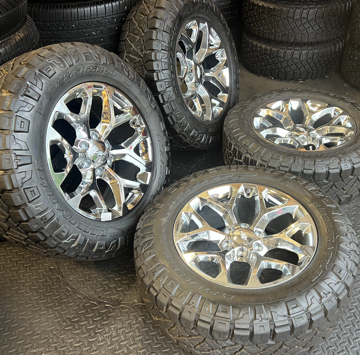 OEM 20” Chrome Truck Wheels wrapped in Nitto Ridge Grappler tires.