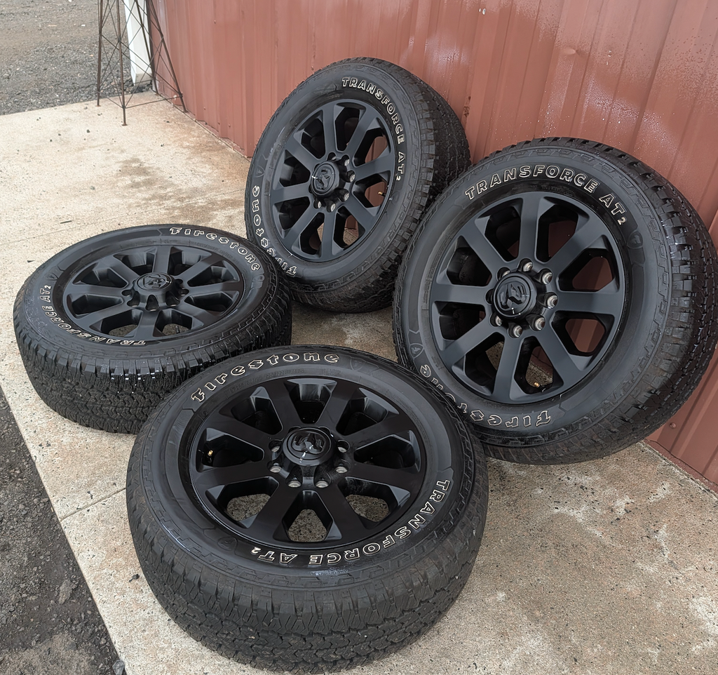 Matte Black Ram 2500 / 3500 OEM 20” Wrapped in Firestone Transforce AT2 LT285/60R20