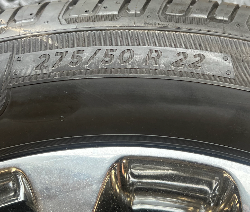 OEM 22” Polished 6-Split-Spoke Wheels wrapped in Bridgestone tires.
