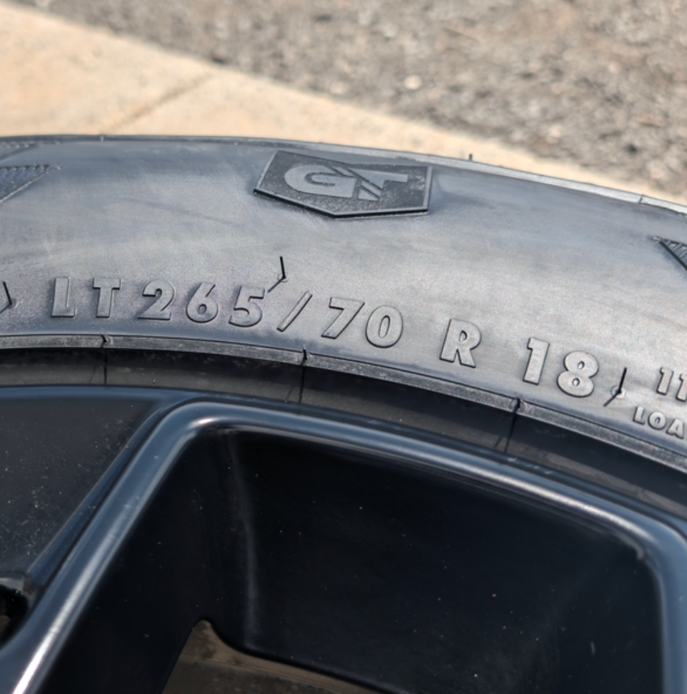 Matte Black Ford F-150 Tremor OEM 18” Wrapped in General Grabber APT LT265/70R18