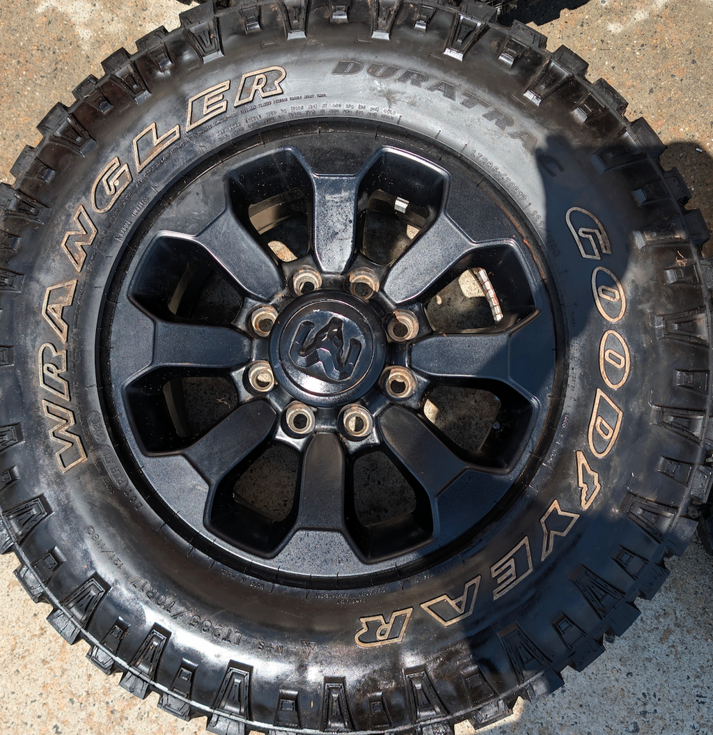 Matte Black Ram 2500 Power Wagon OEM 17” Wrapped in Goodyear Wrangler DuraTrac LT285/70R17