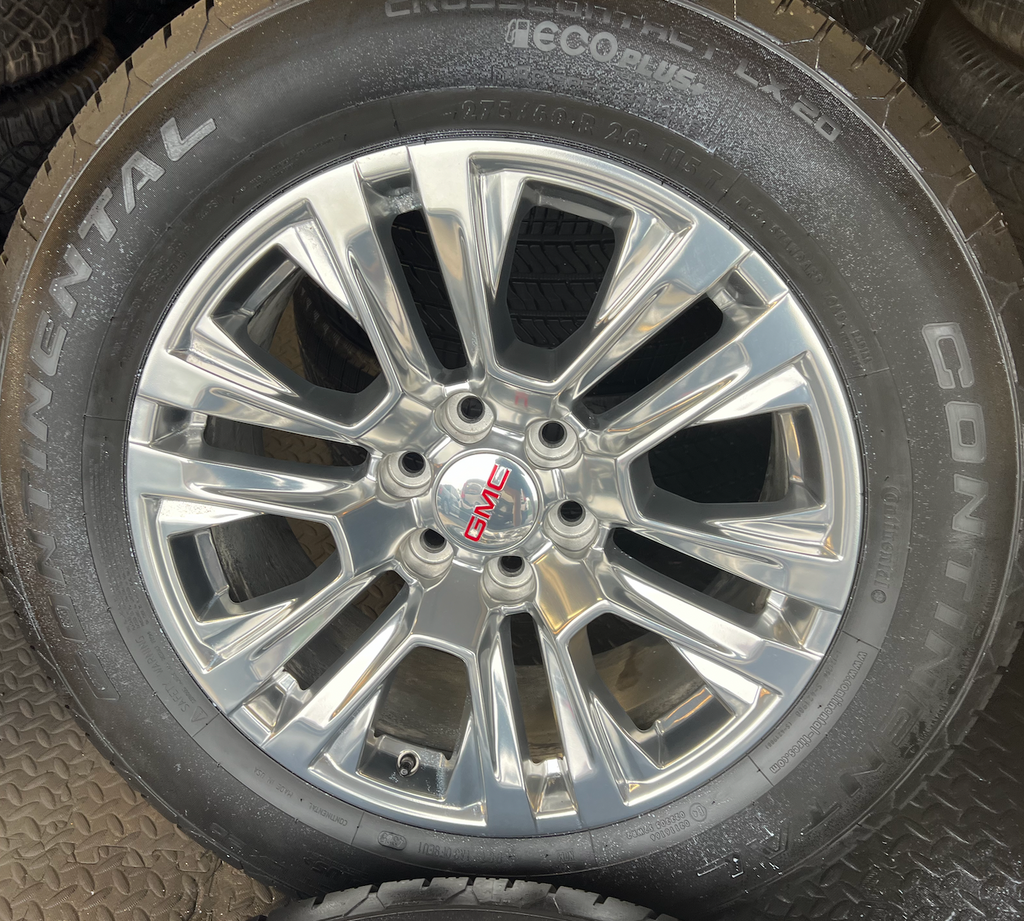 OEM 20” Polished Wheels wrapped in 20” Continental tires.