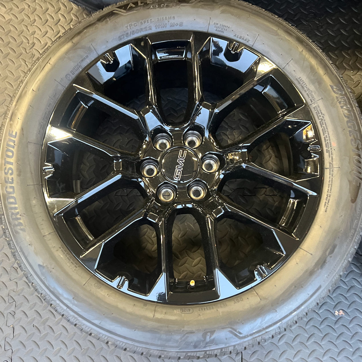 OEM 22” Gloss Black 6-Split-Spoke Replica Wheels wrapped in Bridgestone tires.