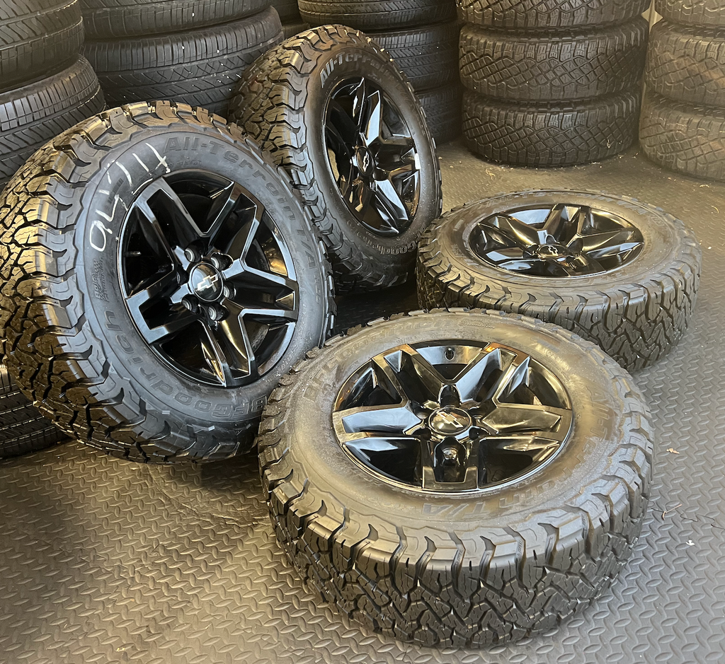 OEM 18” Black Trail Boss Wheels wrapped in BFGoodrich All-Terrain T/A tires.