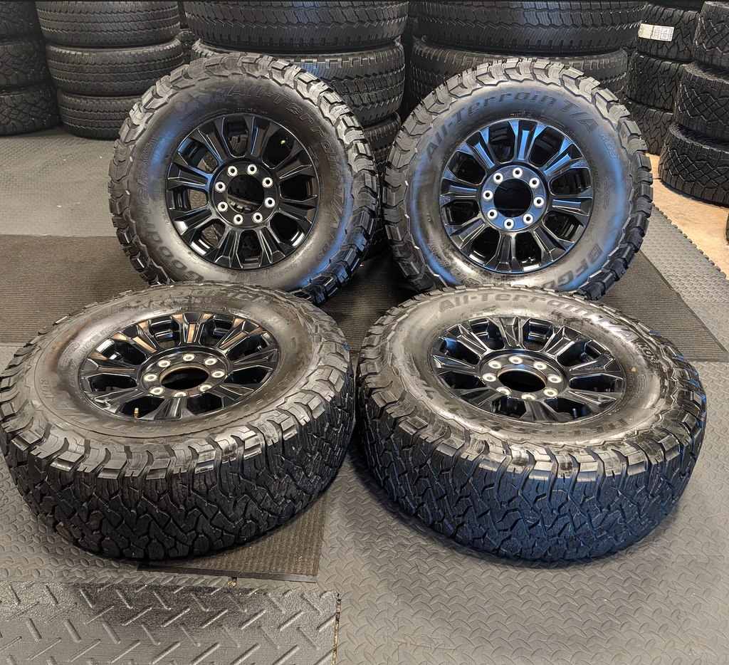 OEM 18” Ford F-250 / F-350 Tremor Wheels with Gloss Black Finish wrapped in BFGoodrich All-Terrain T/A KO3 tires.