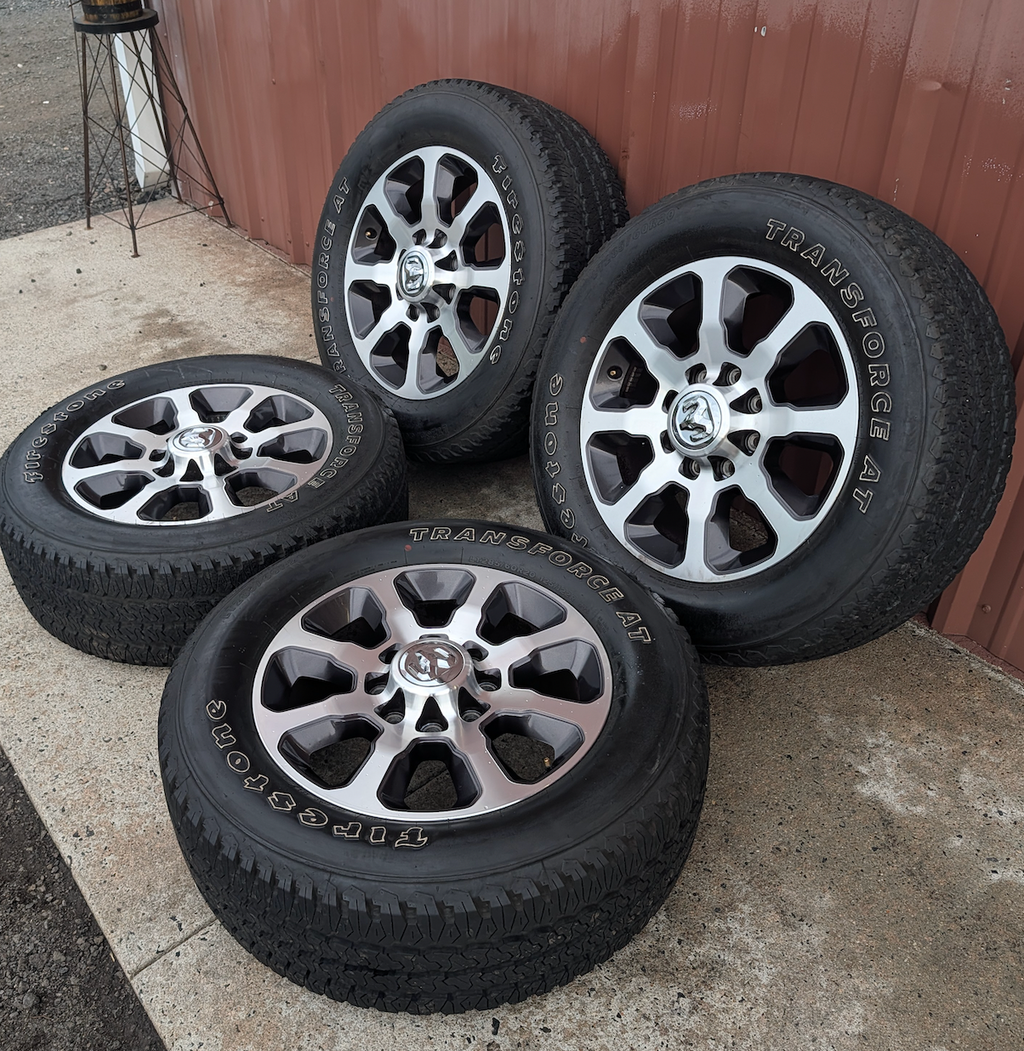 Machined 2500 / 3500 Laramie Longhorn OEM 20” Wrapped in Firestone Transforce A/T LT285/60R20
