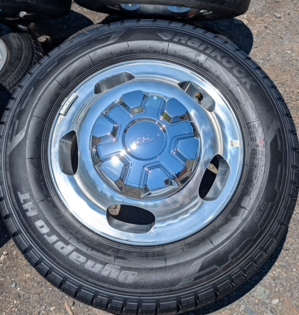 OEM 16” Polished Ford Transit Dual Rear Wheel (Dually) Wheels wrapped in 205/75R16 Hankook Dynapro HT tires.
