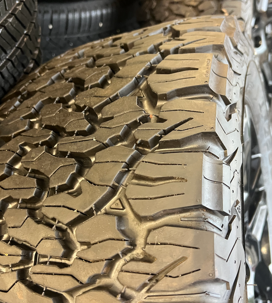 OEM 20” Gloss Black Trail Boss Wheels wrapped in BFGoodrich All-Terrain T/A tires.