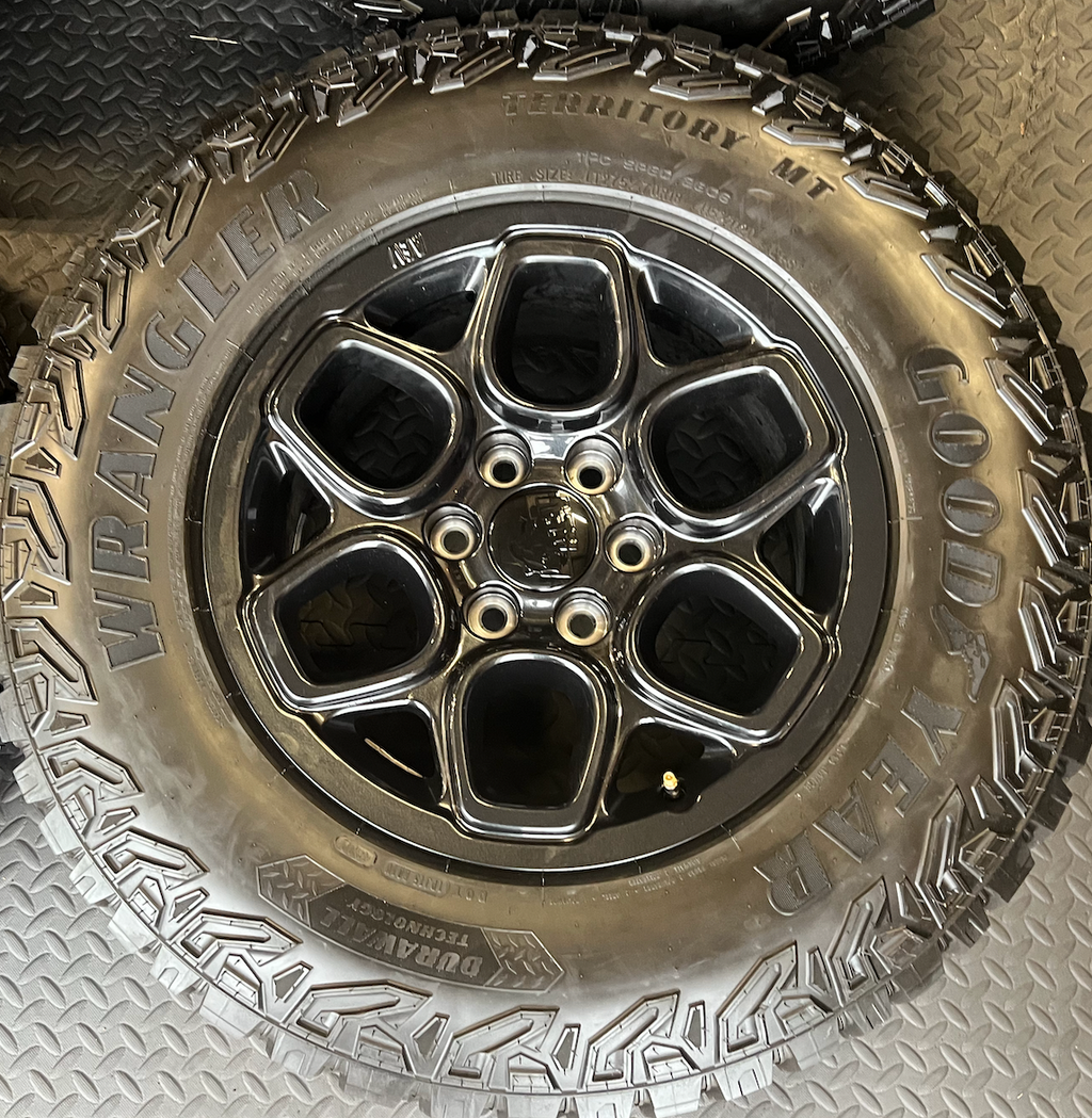 OEM 18”  Wheels wrapped in Goodyear Wrangler Territory M/T tires.
