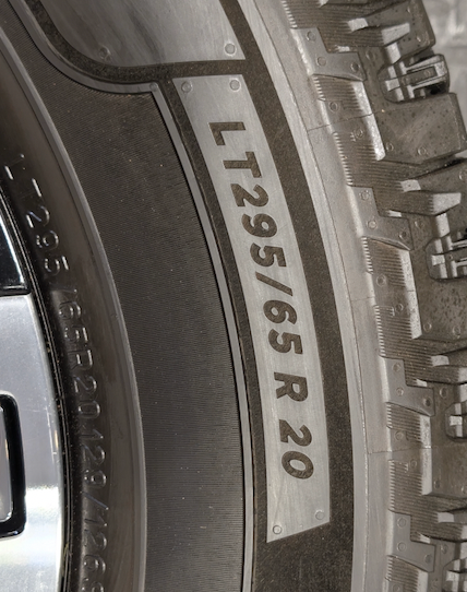 OEM 20” GMC Sierra Denali Ultimate Wheels with Machined & Black Finish wrapped in LT295/65R20 Michelin Defender LTX Platinum tires.