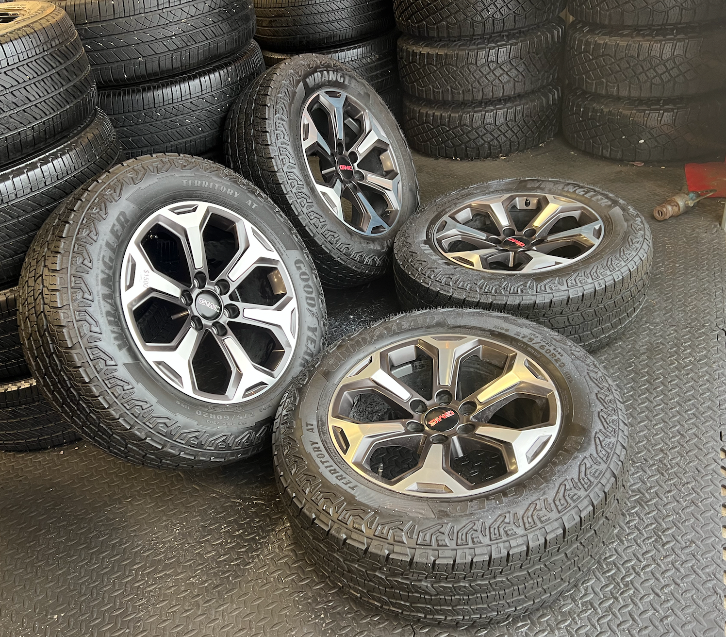 OEM 20”  Wheels wrapped in Goodyear Wrangler Territory AT tires.