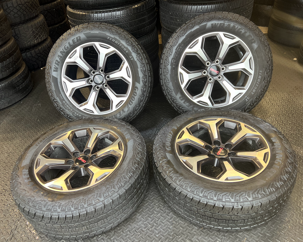 OEM 20”  Wheels wrapped in Goodyear Wrangler Territory AT tires.
