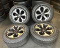 OEM 20”  Wheels wrapped in Goodyear Wrangler Territory AT tires.