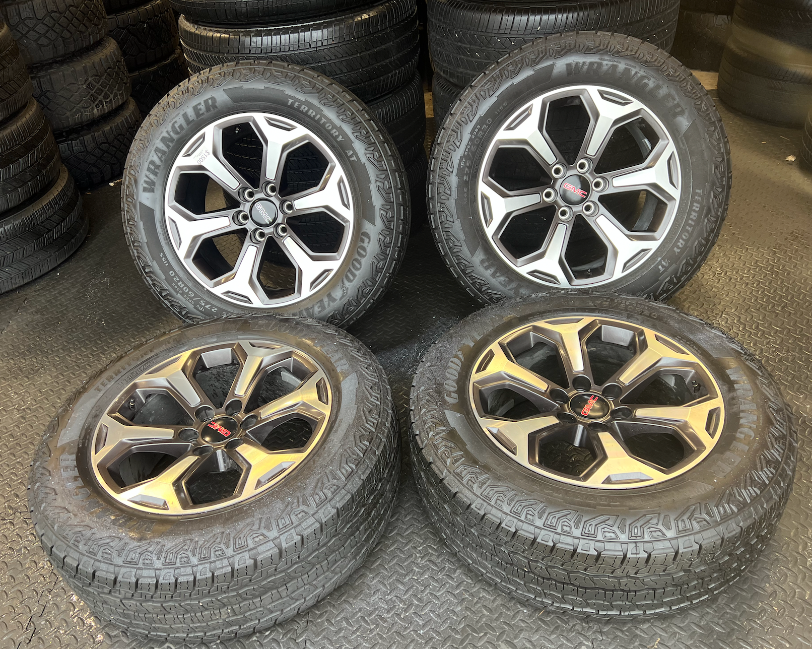 OEM 20”  Wheels wrapped in Goodyear Wrangler Territory AT tires.