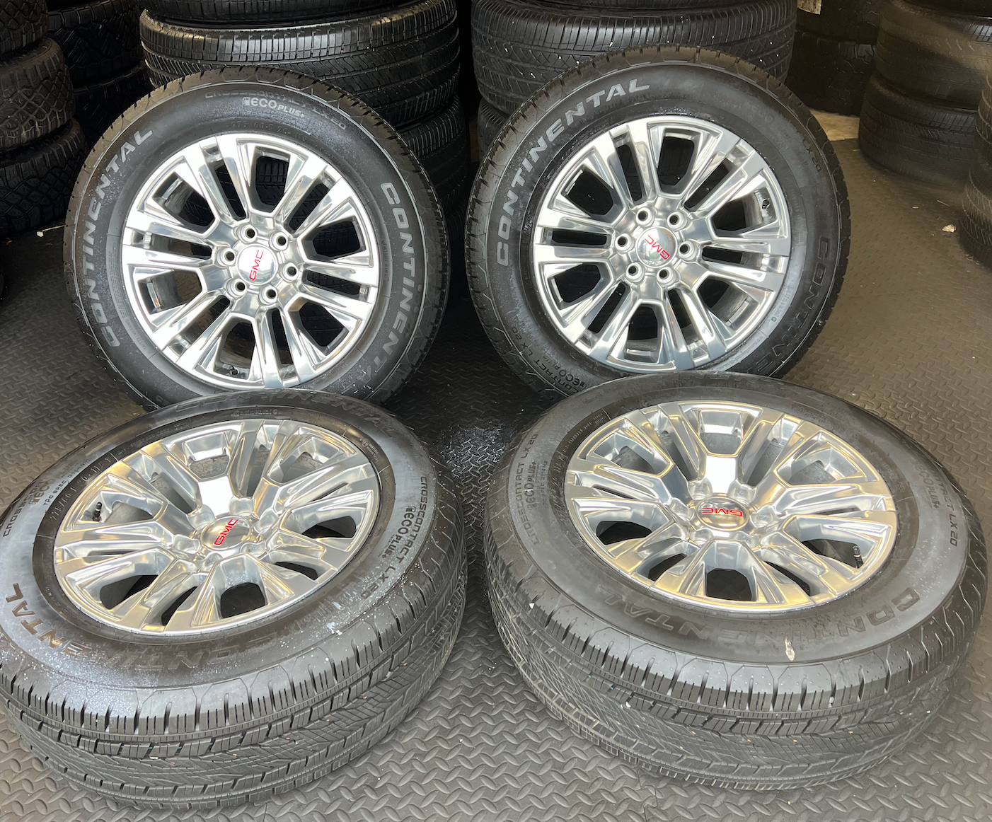 OEM 20” Polished Wheels wrapped in 20” Continental tires.
