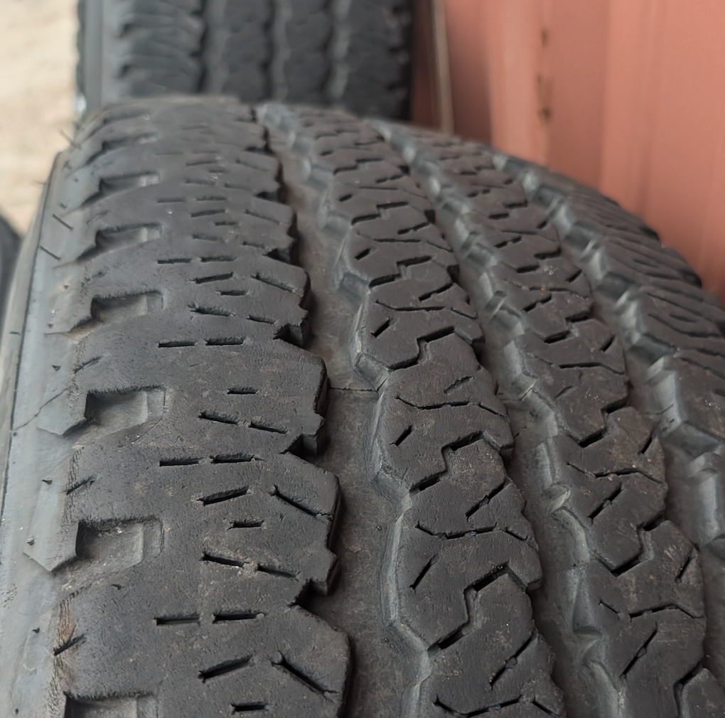 Machined 2500 / 3500 Laramie Longhorn OEM 20” Wrapped in Firestone Transforce A/T LT285/60R20