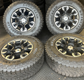 OEM 18” Gloss Black Machined Face Chevrolet Wheels wrapped in Goodyear Wrangler Territory M/T tires.