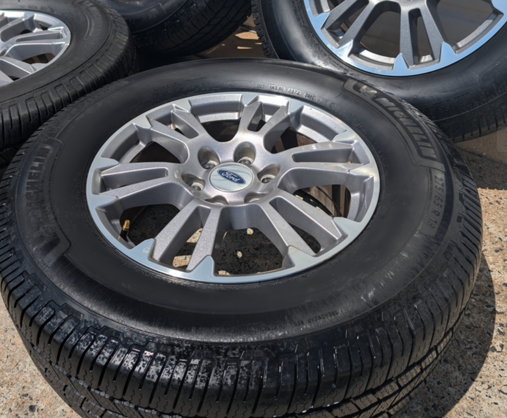 Gray Machined Ford F-150 Lariat OEM 18” Wrapped in Michelin Defender LTX 275/65R18