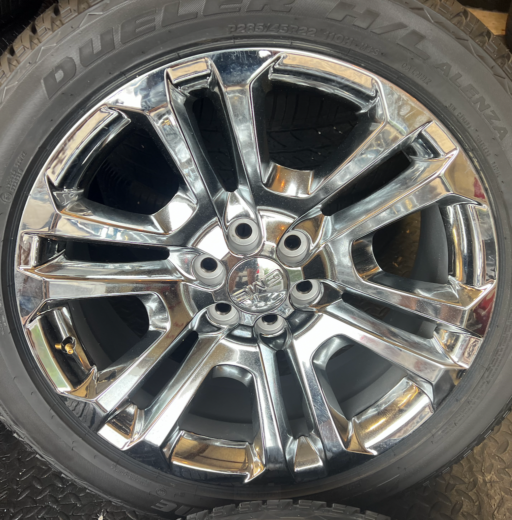 OEM 22” Split 6 Chrome Wheels wrapped in Bridgestone Dueler H/L Alenza tires.