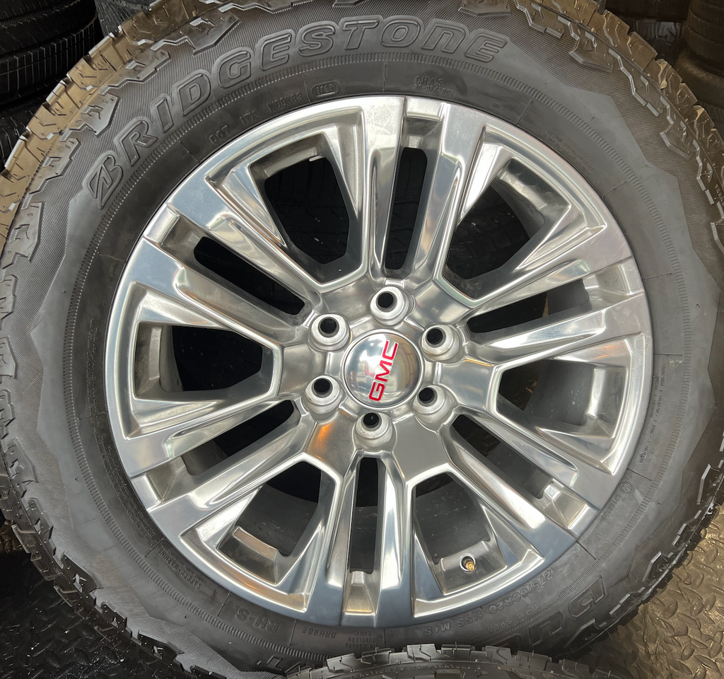 OEM Rebuilt 20” Polished Wheels wrapped in Bridgestone Dueler tires.