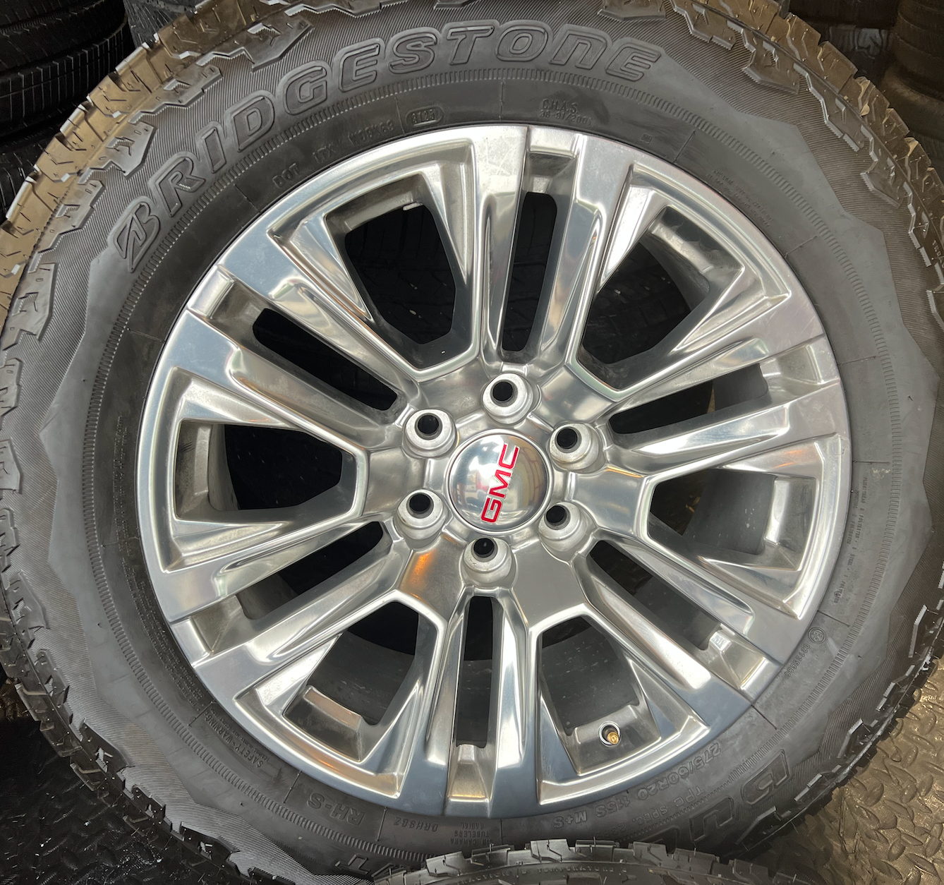OEM Rebuilt 20” Polished Wheels wrapped in Bridgestone Dueler tires.