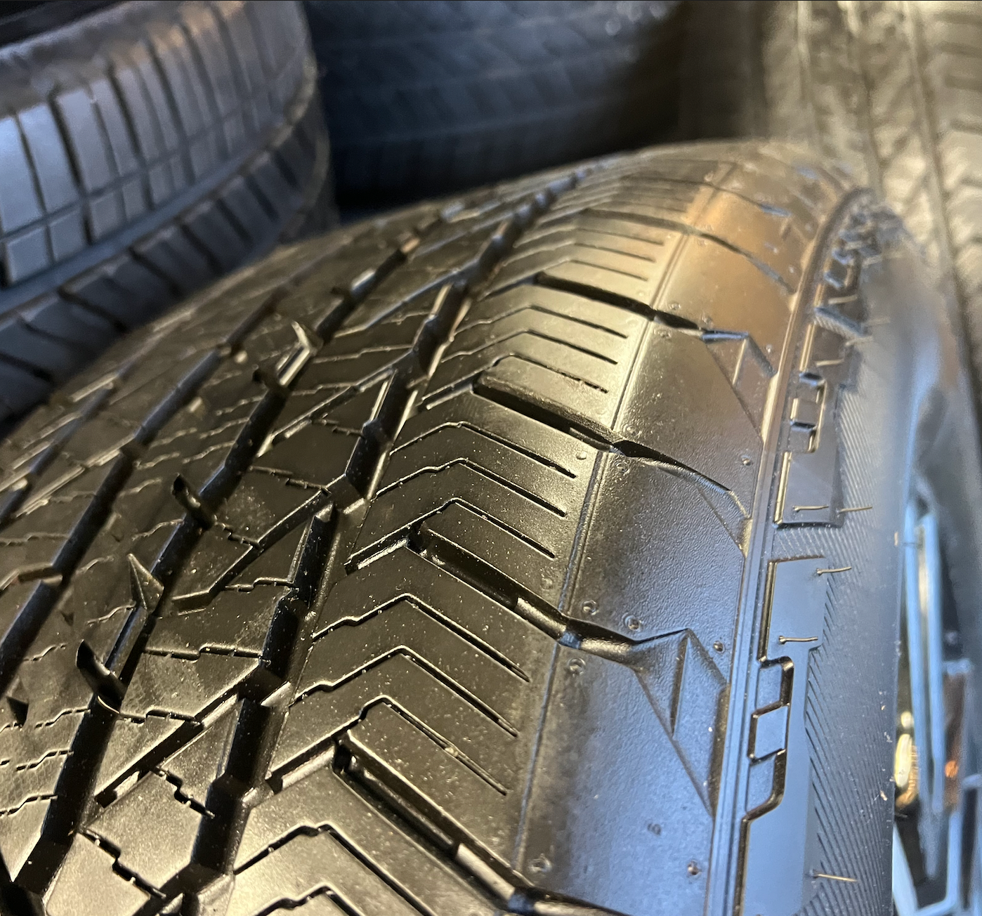 OEM 20” Gloss Black Wheels with Silver Inserts / Accents wrapped in Hankook Dynapro AT2 tires.