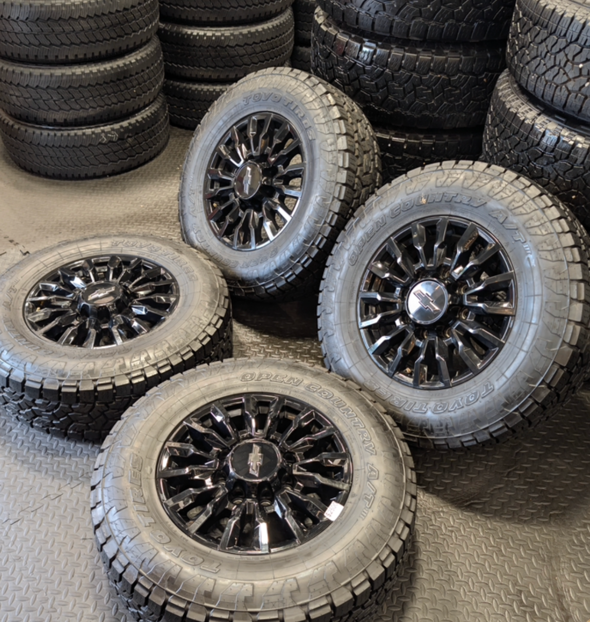 OEM 18” Chevrolet Silverado ZR2 2500HD / 3500HD Gloss Black Wheels wrapped in Toyo Open Country A/T tires.