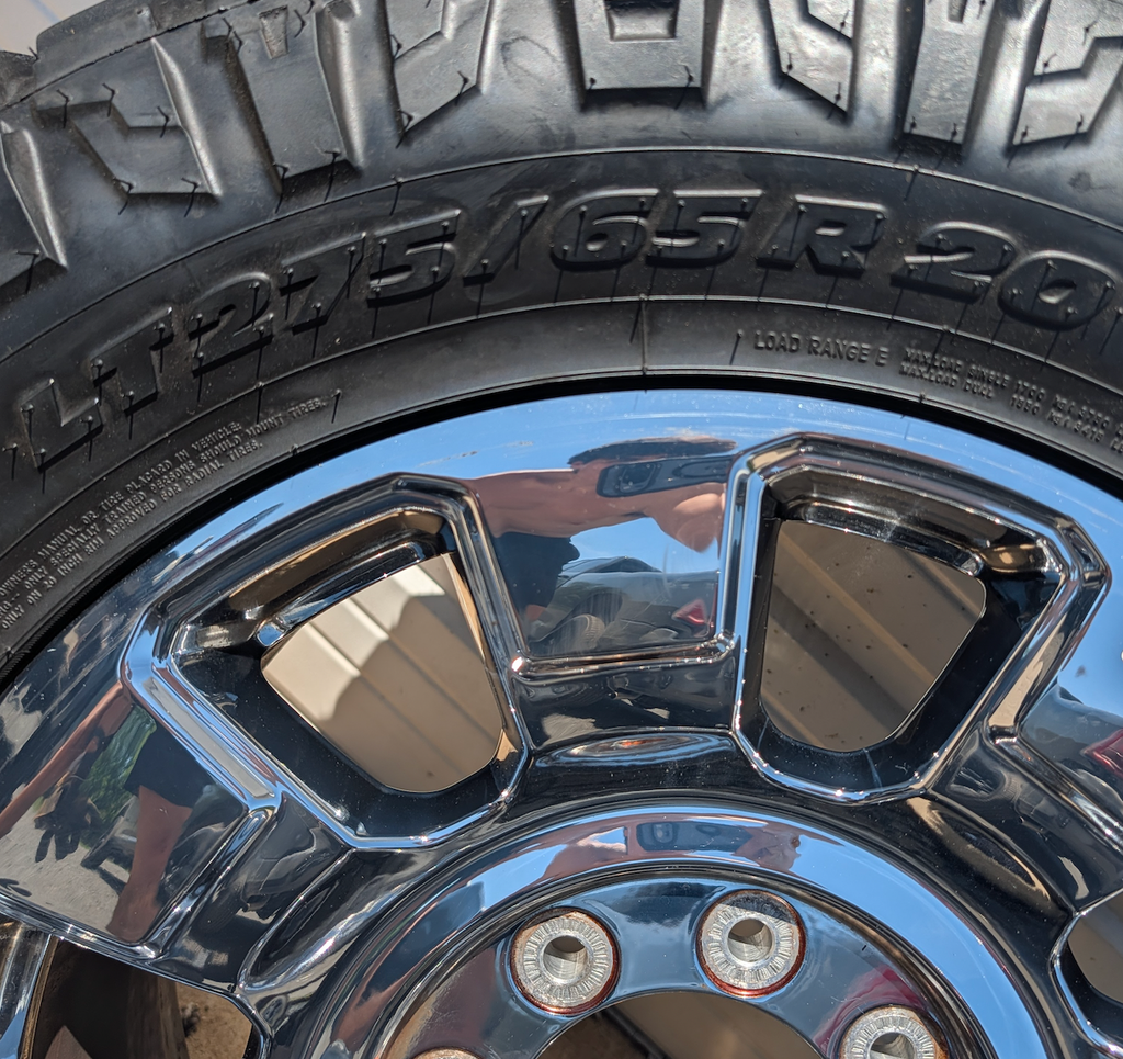 OEM 20” Chrome Ford F-250 / F-350 King Ranch / Lariat Wheels wrapped in LT275/65R20 Nitto Ridge Grappler tires.