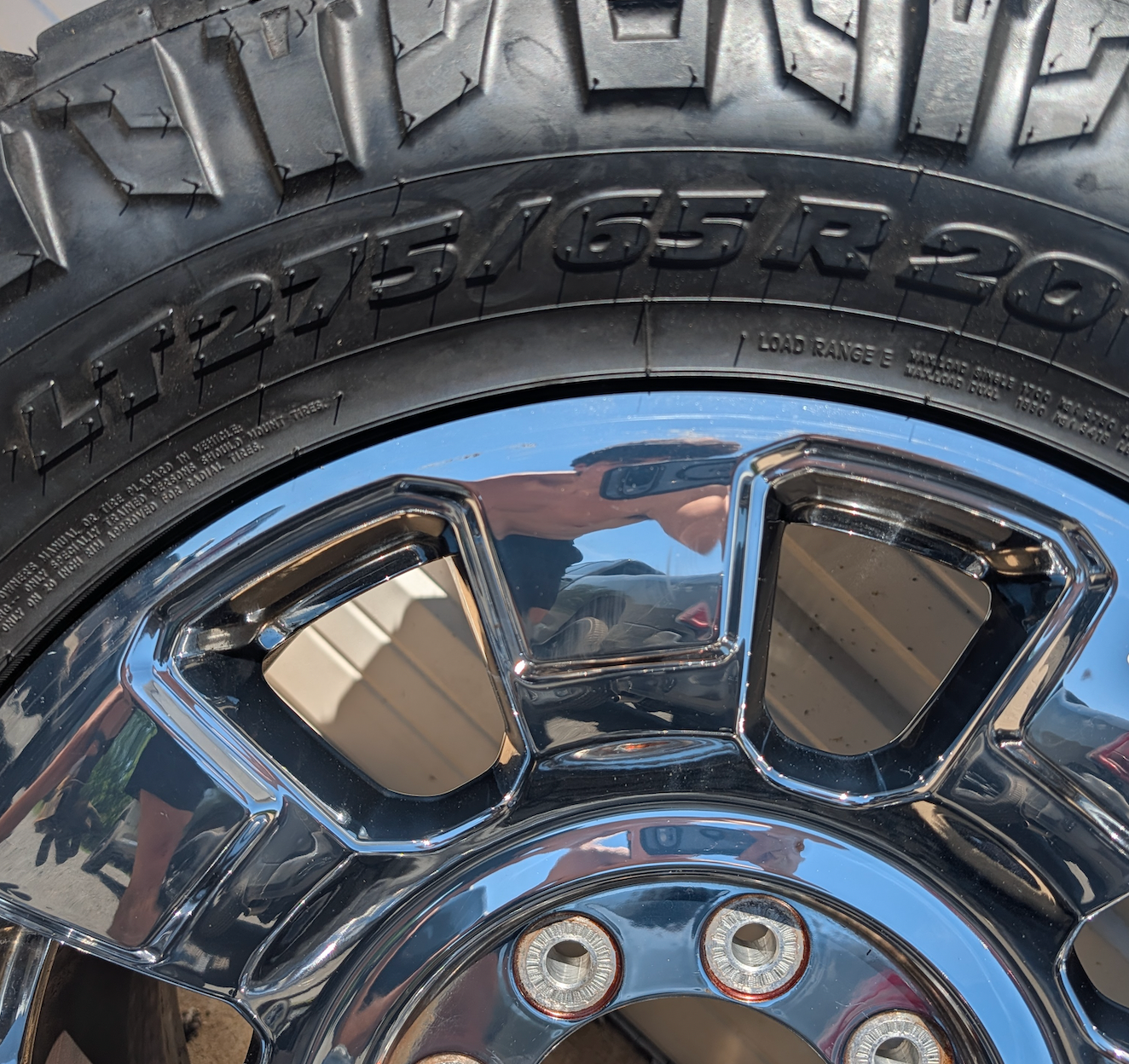 OEM 20” Chrome Ford F-250 / F-350 King Ranch / Lariat Wheels wrapped in LT275/65R20 Nitto Ridge Grappler tires.
