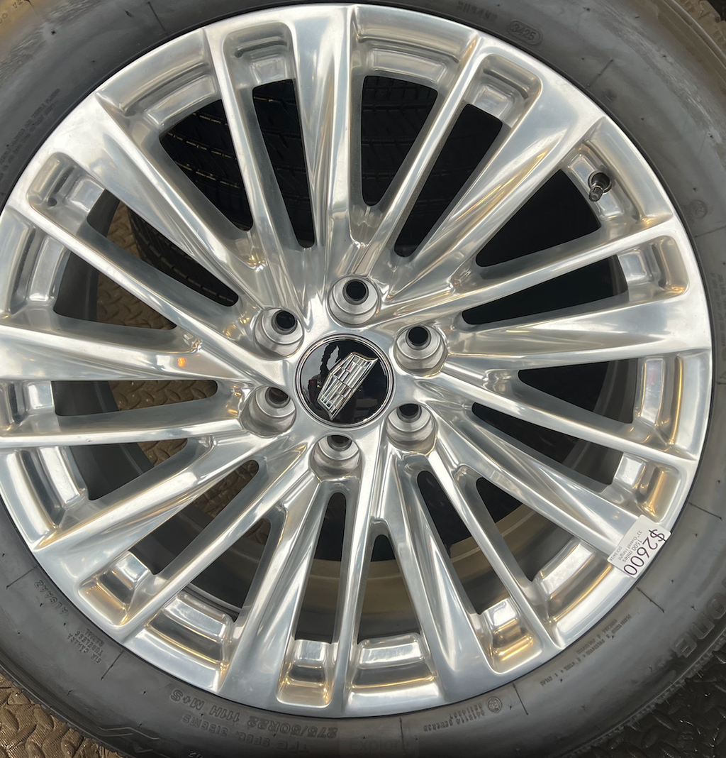 OEM 22” Polished Aluminum Wheels wrapped in Bridgestone tires.