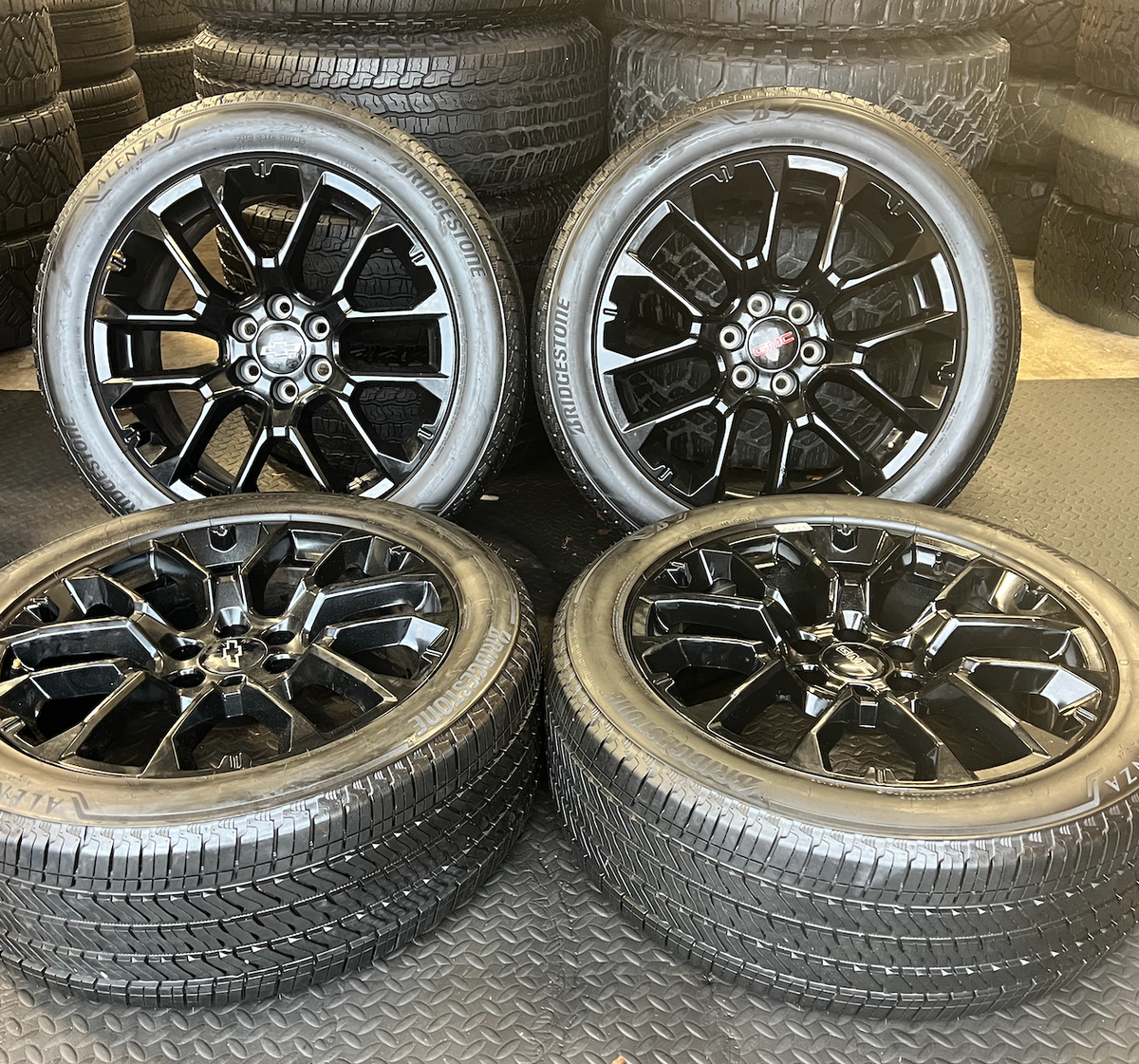 Gloss Black GMC Yukon Denali OEM 22” Wrapped in Bridgestone 275/50R22