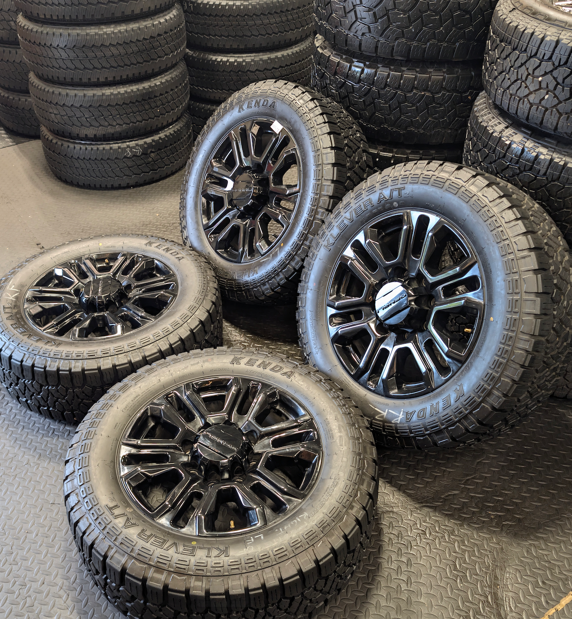 OEM 20” GMC Sierra Denali Black Wheels wrapped in Kenda Klever A/T tires.