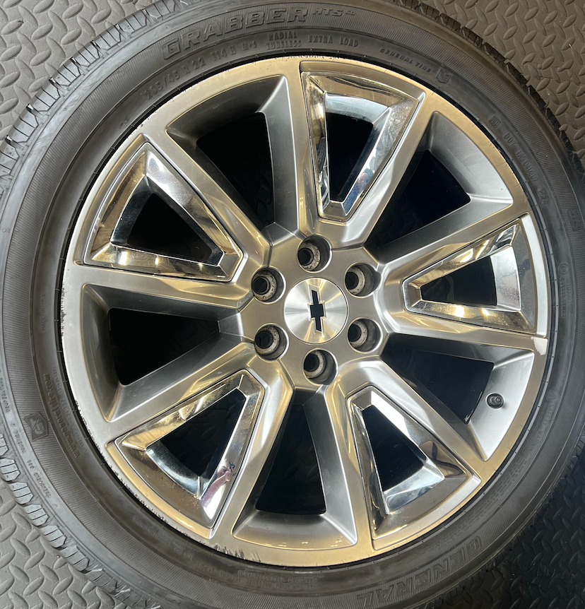OEM 22” Wheels with Hypersilver Finish & Chrome Inserts wrapped in General Grabber tires.