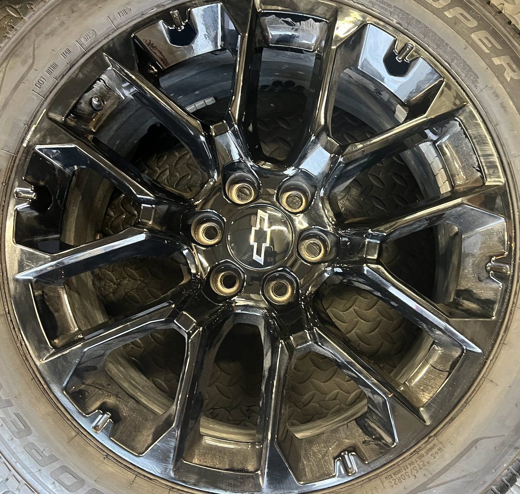 OEM 22” Gloss Black Chevrolet Wheels wrapped in Cooper ProControl tires.