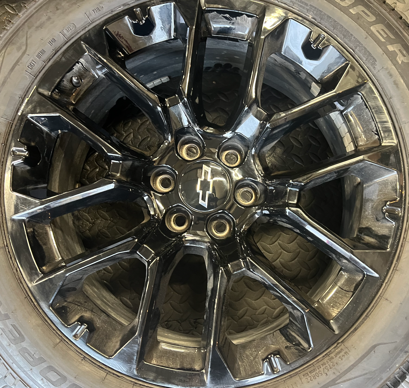 OEM 22” Gloss Black Chevrolet Wheels wrapped in Cooper ProControl tires.