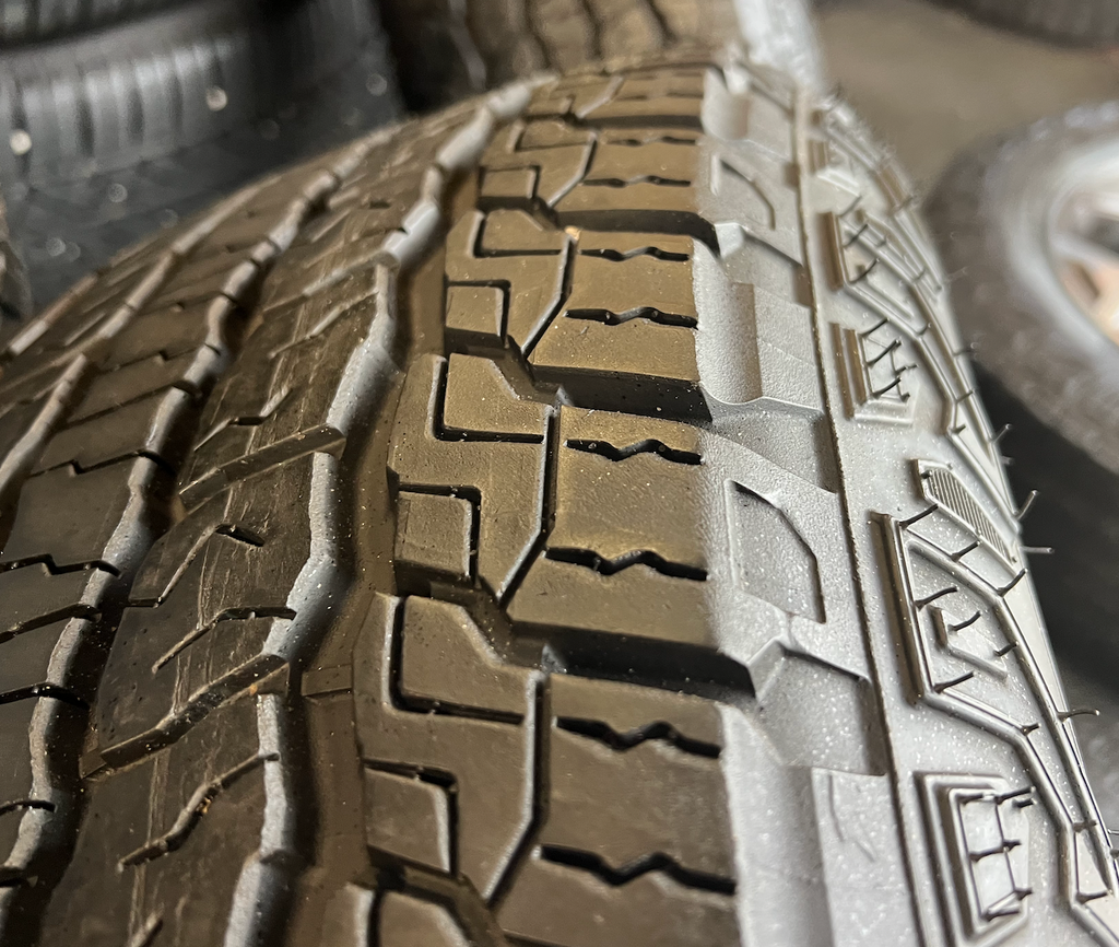OEM 20”  Wheels wrapped in Goodyear Wrangler Territory AT tires.