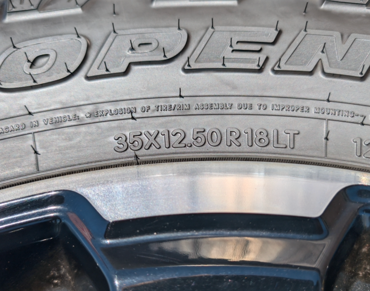 Machined Ford F-250 / F-350 Tremor OEM 18” Wrapped in Toyo Open Country A/T 35x12.50R18LT 128Q