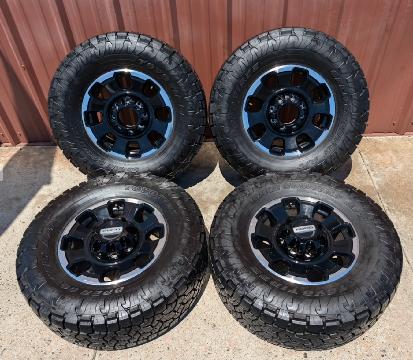Machined Ford F-250 / F-350 Tremor OEM 18” Wrapped in Toyo Open Country A/T 35x12.50R18LT 128Q
