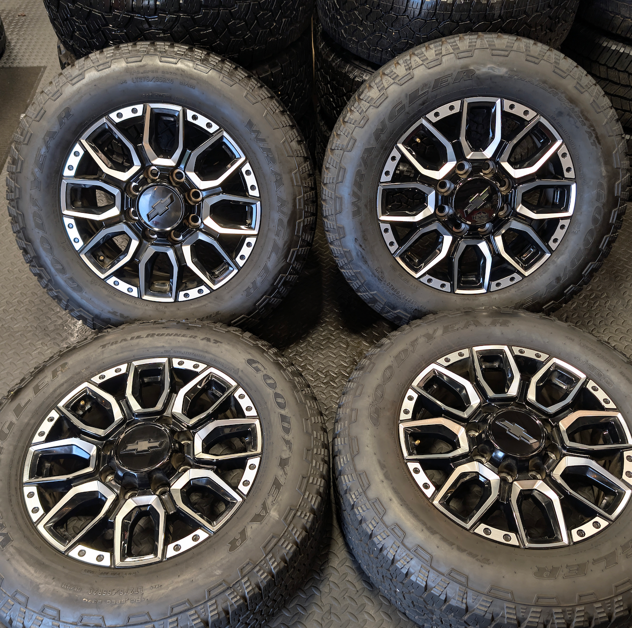 OEM 20” Machined GM 2500HD / 3500HD Wheels wrapped in Goodyear Wrangler TrailRunner A/T tires.