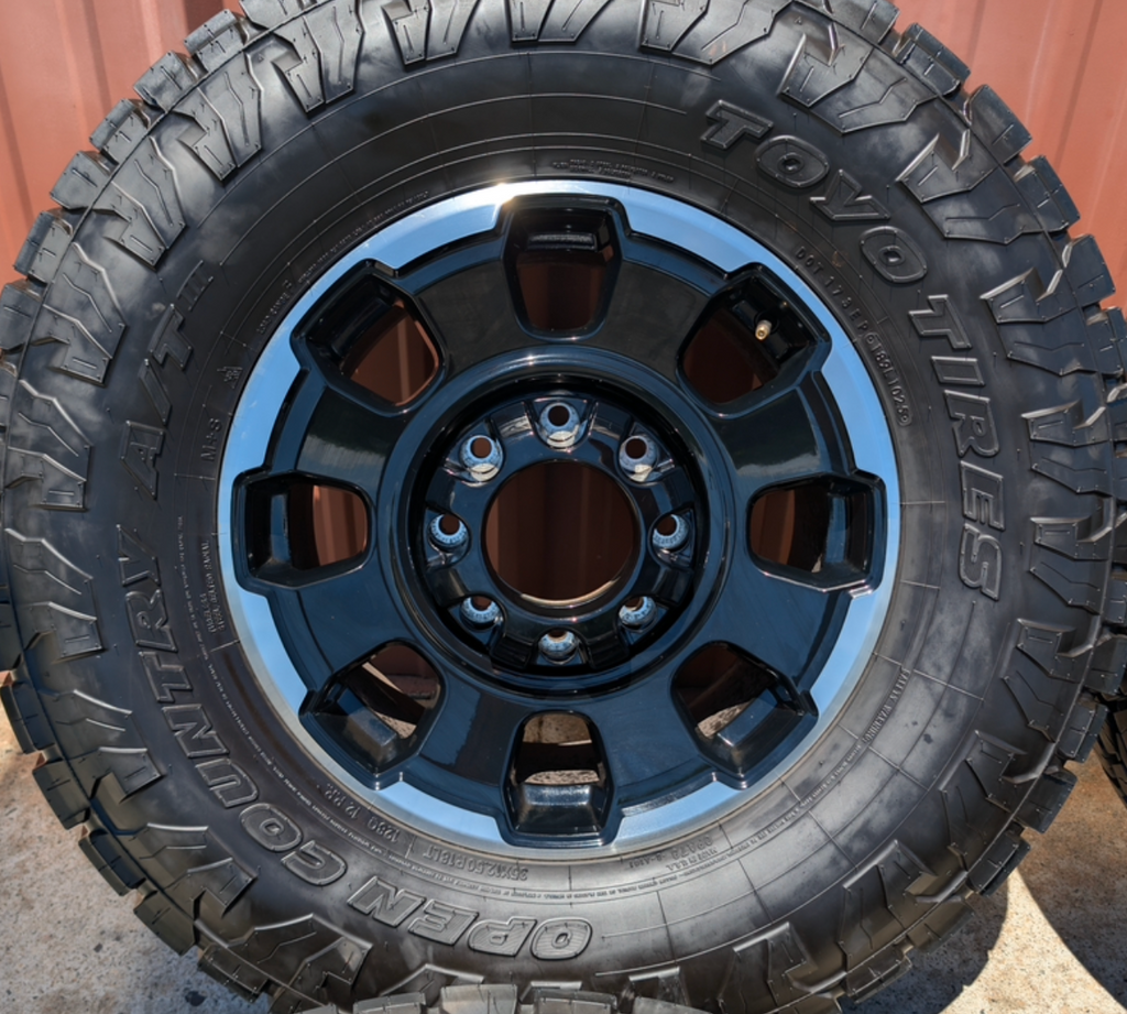 Machined Ford F-250 / F-350 Tremor OEM 18” Wrapped in Toyo Open Country A/T 35x12.50R18LT 128Q