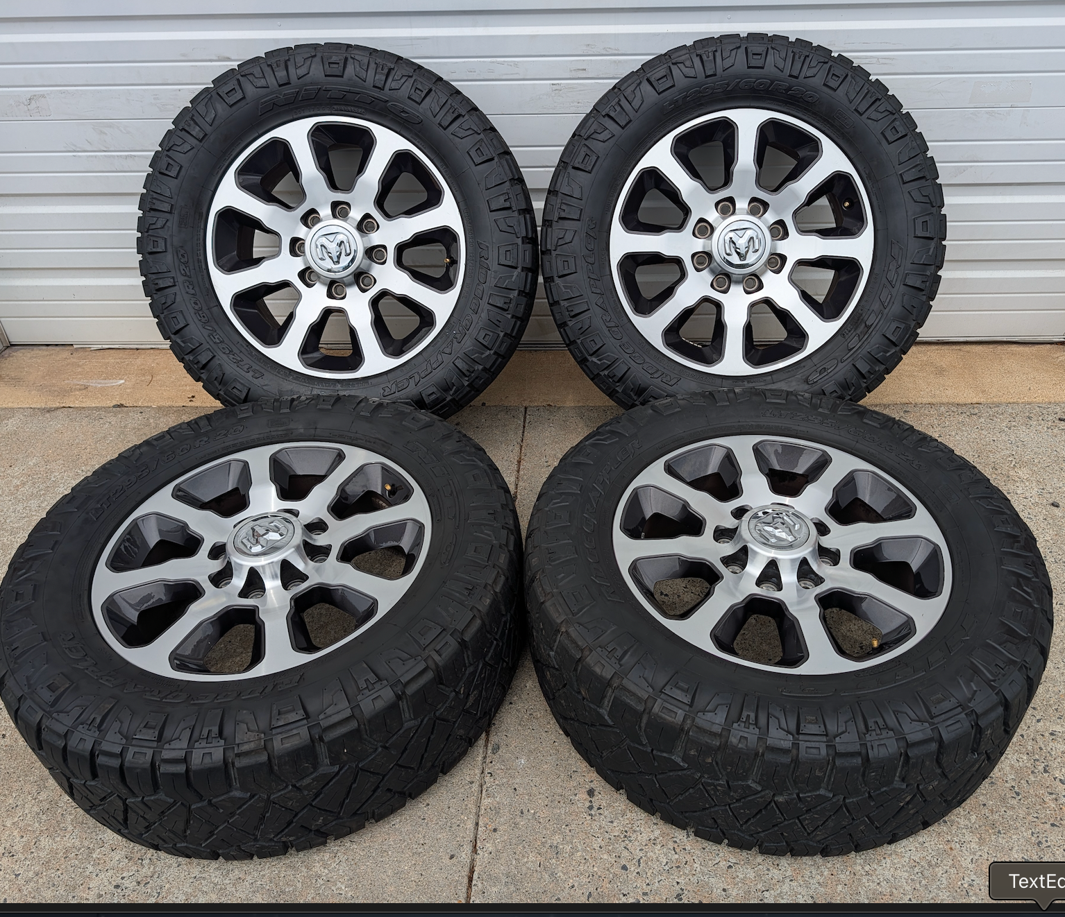 Machined Ram 2500 / 3500 OEM 20” Wrapped in Nitto Ridge Grappler LT295/60R20